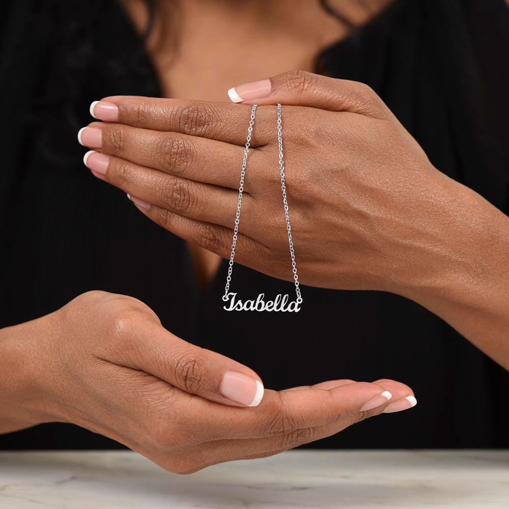 stainless steel name necklace held on hand